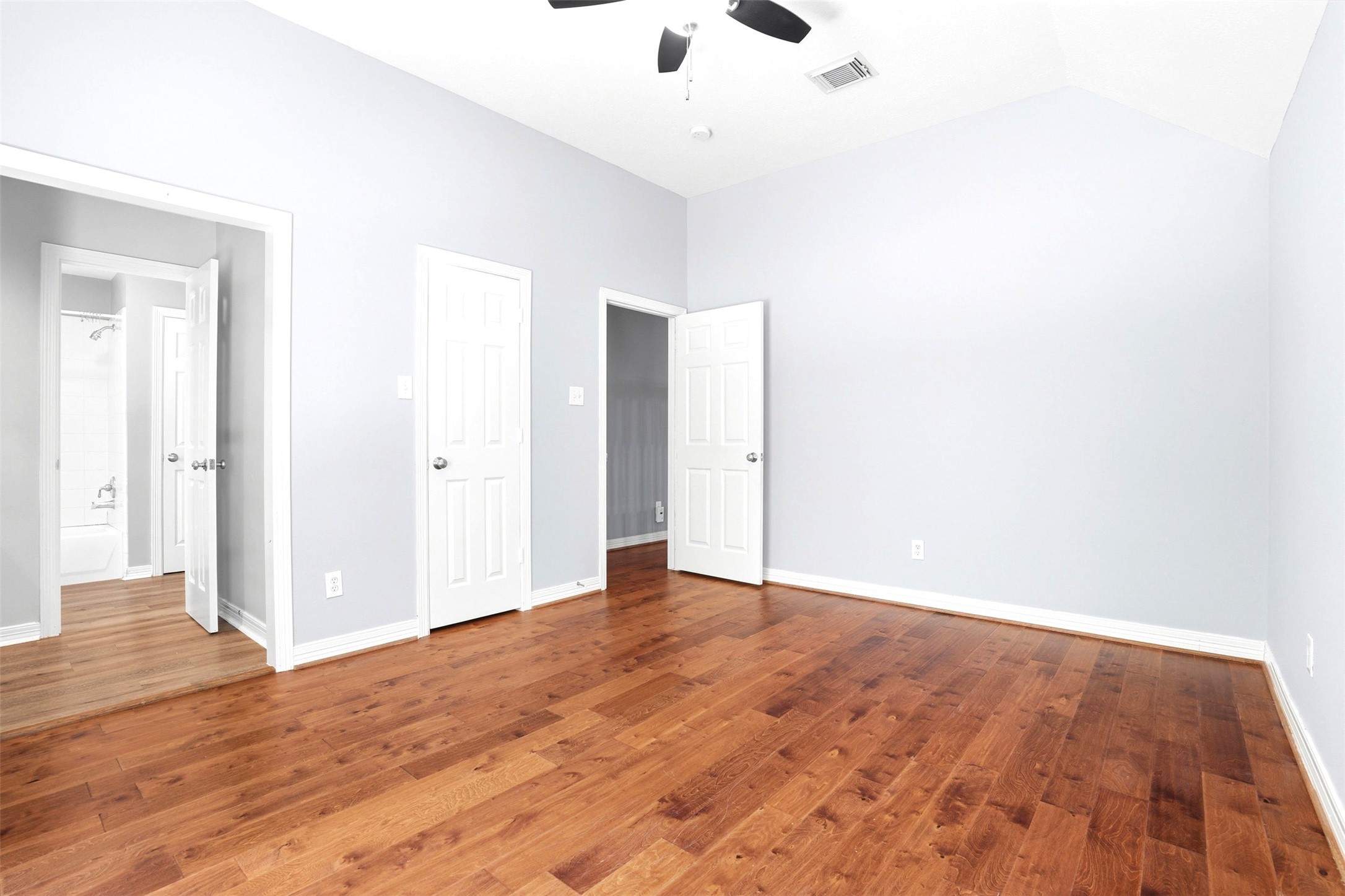 4707 Stackstone Lane Katy, TX 77450 - Photo 33 of 50 an empty room with wooden floor and windows