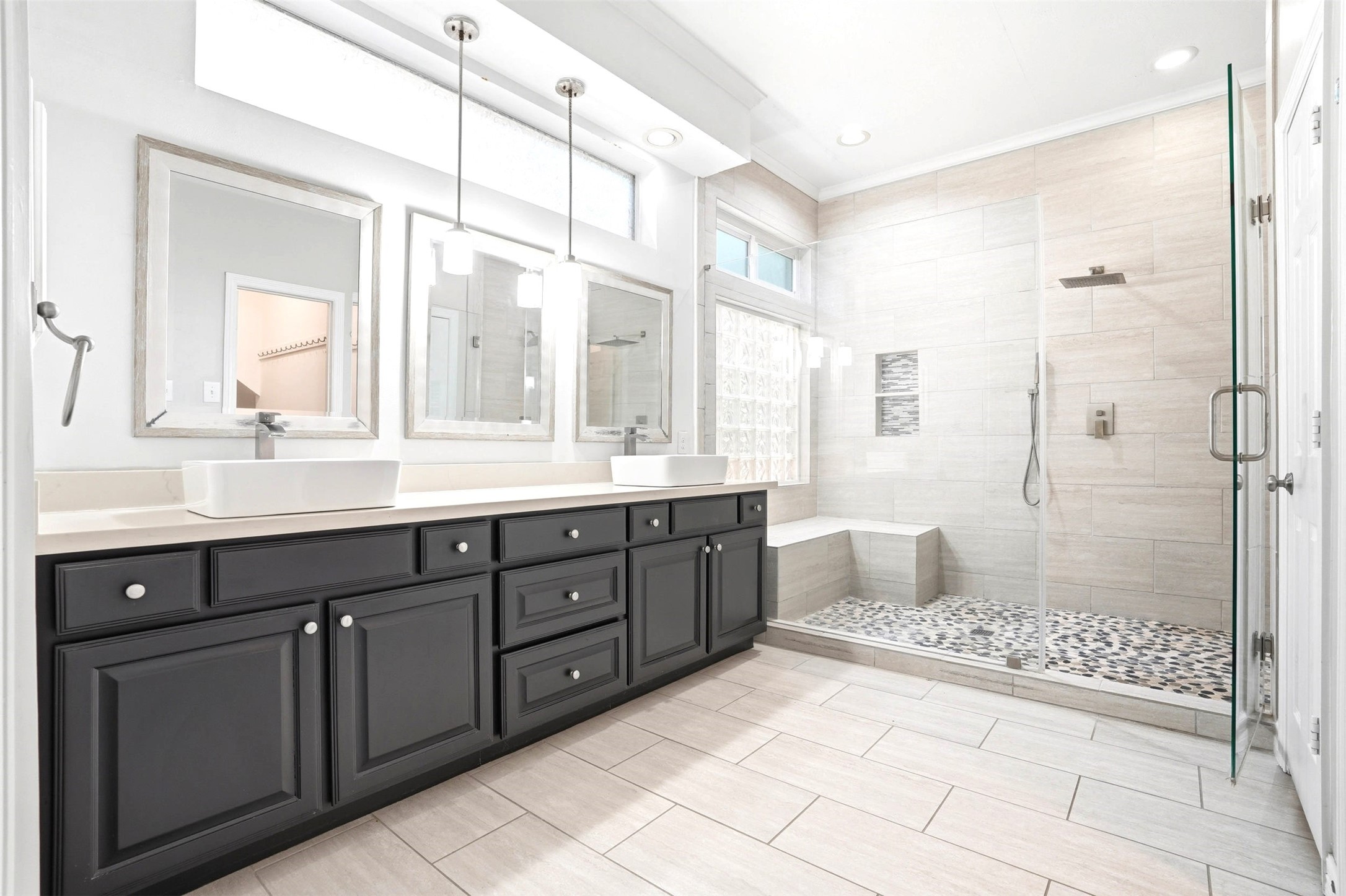 4707 Stackstone Lane Katy, TX 77450 - Photo 4 of 50 a spacious bathroom with a granite countertop sink a toilet a mirror and shower