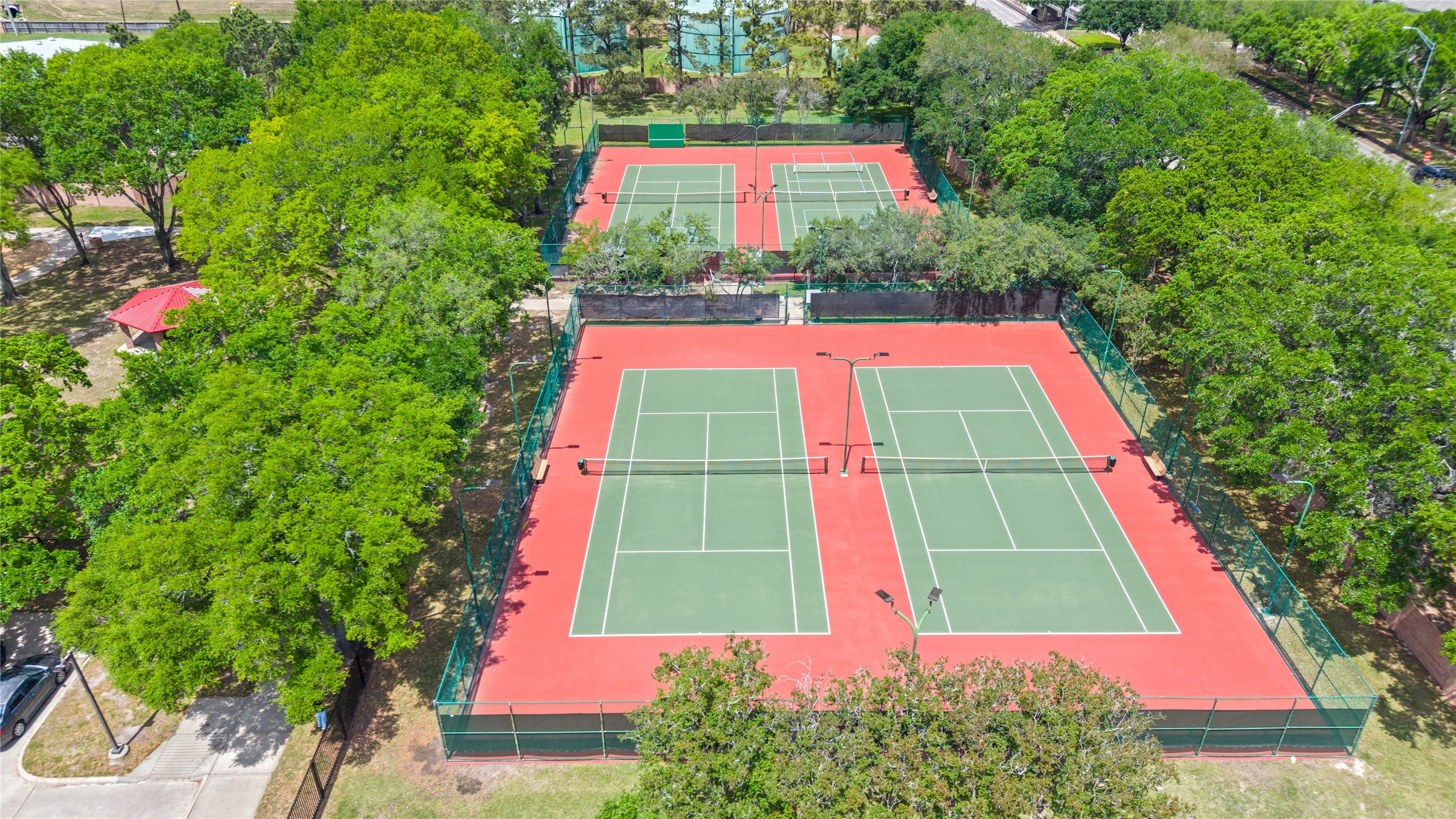 4707 Stackstone Lane Katy, TX 77450 - Photo 40 of 50 a view of swimming pool with red and red chairs