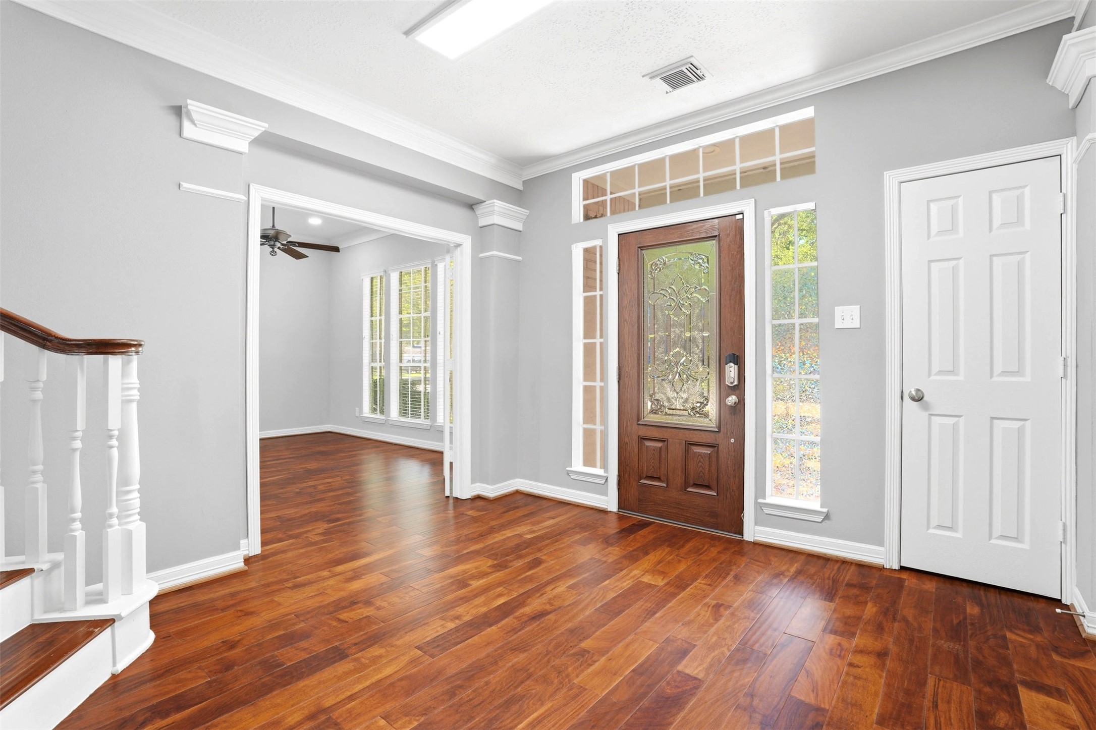 4707 Stackstone Lane Katy, TX 77450 - Photo 8 of 50 wooden floor and windows in an empty room