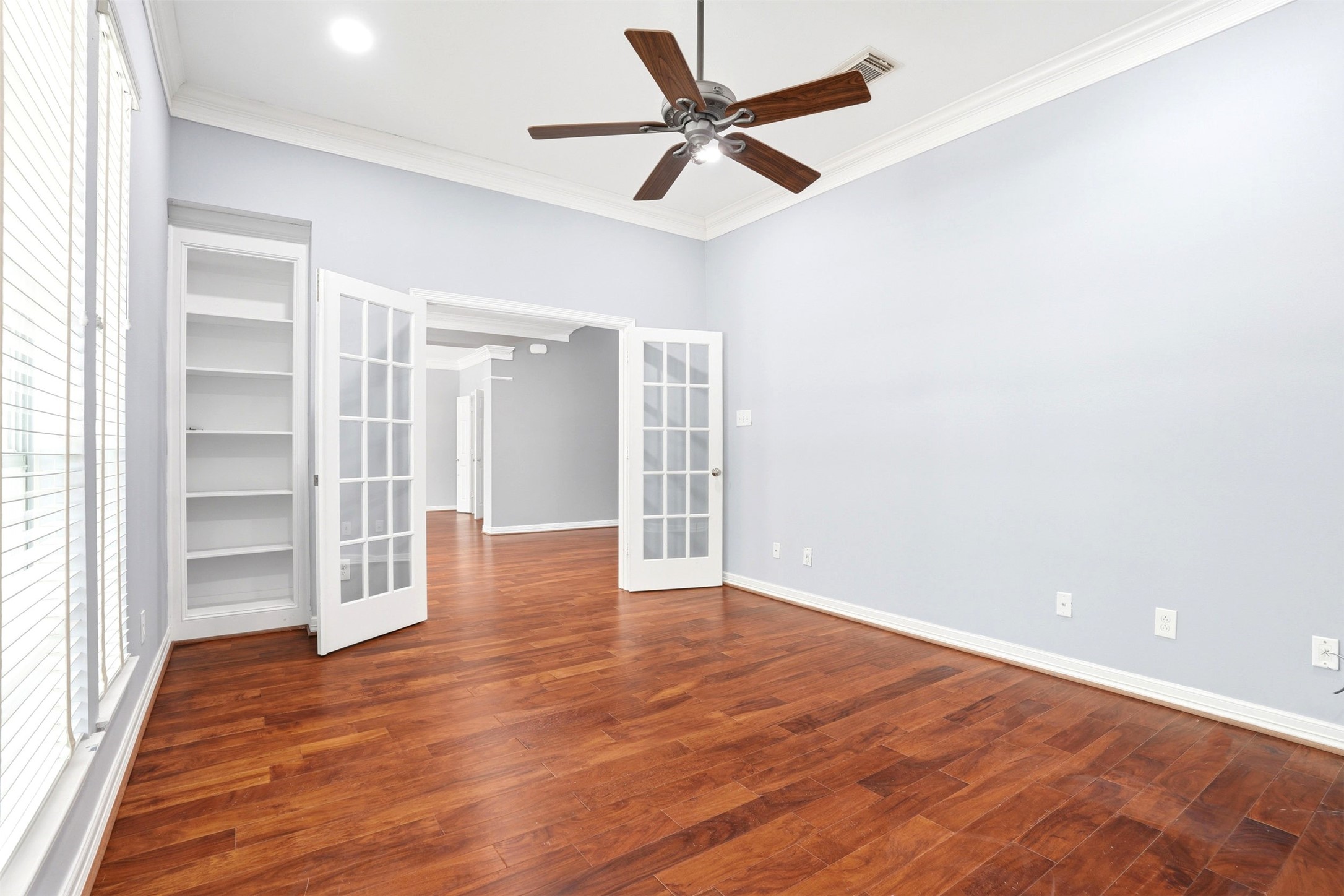 4707 Stackstone Lane Katy, TX 77450 - Photo 9 of 50 wooden floor in an empty room with a window