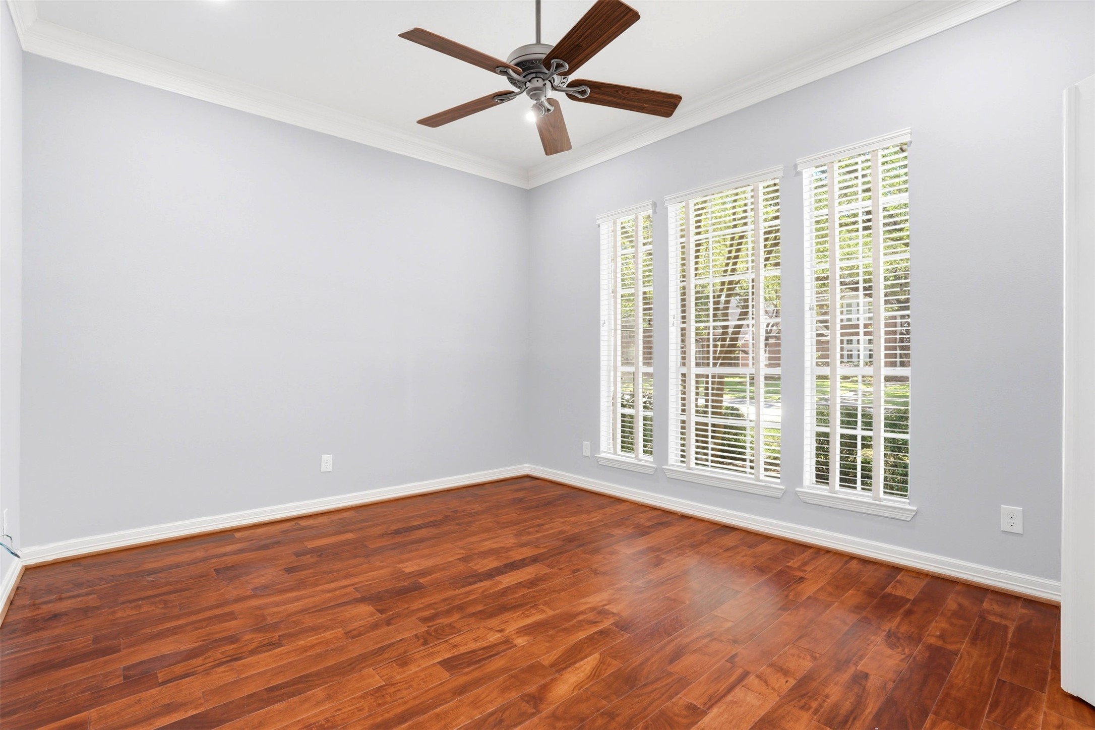 4707 Stackstone Lane Katy, TX 77450 - Photo 10 of 50 an empty room with wooden floor and windows