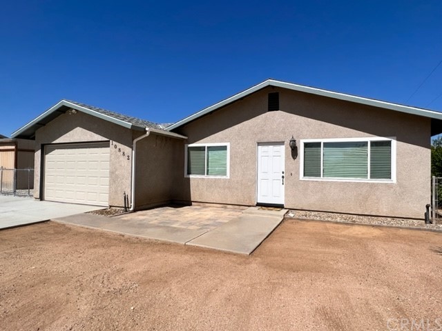 10882 Pinole Road Apple Valley, CA 92308 - Photo 1 of 1 a front view of a house with a yard