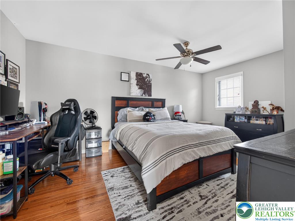 4148 Ross Road Bethlehem, PA 18020 - Photo 58 of 67 Hardwood flooring extends throughout this naturally illuminated bedroom, complete with a window and a ceiling fan for comfort.