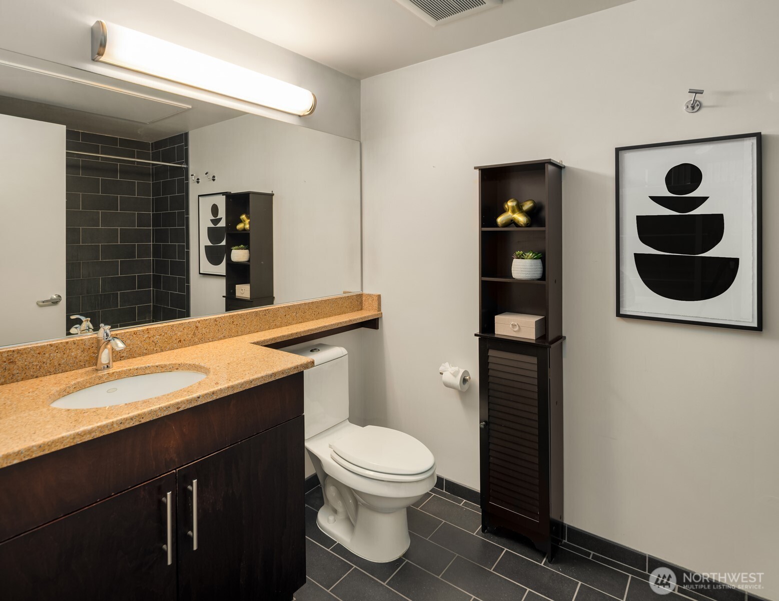2720 3rd Avenue, Unit 505 Seattle, WA 98121 - Photo 9 of 25 a bathroom with a toilet a sink and mirror