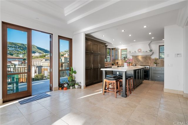 a kitchen with stainless steel appliances a stove and a refrigerator