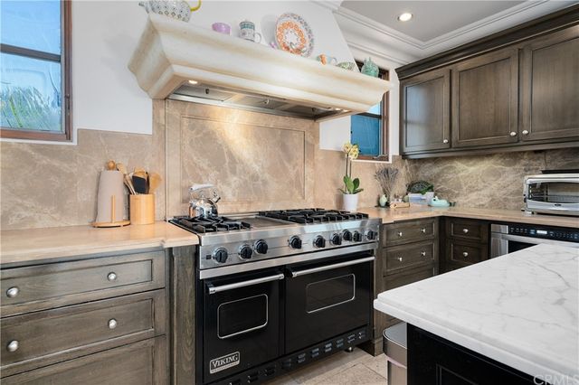 a view of a dining room with furniture and a potted plant