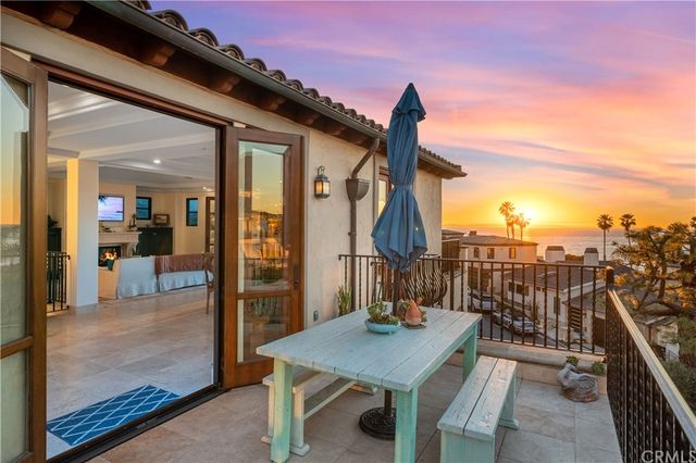 a bedroom with furniture and a wooden floor