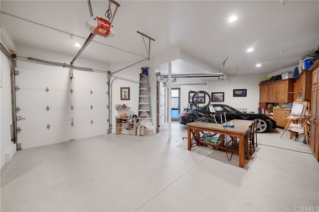 an aerial view of multiple houses with a yard