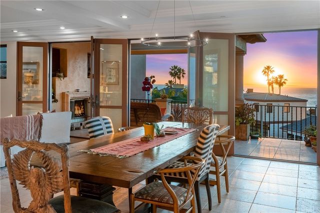 a outdoor dining space with furniture and chandelier