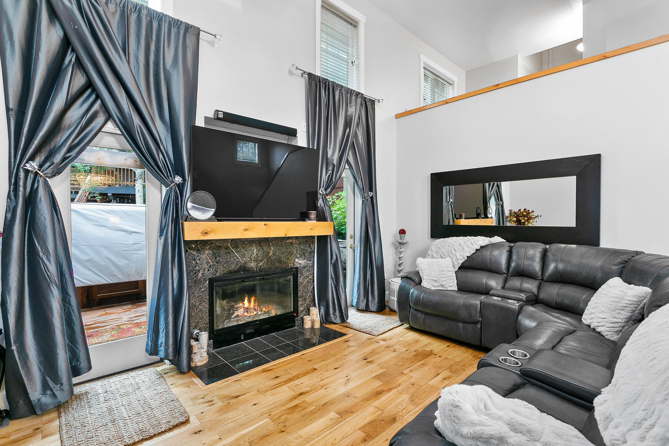 62672 Larkview Road Bend, OR 97701 - Photo 20 of 39 a living room with furniture and a fireplace