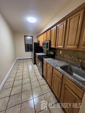 a bedroom with a bed and a desk