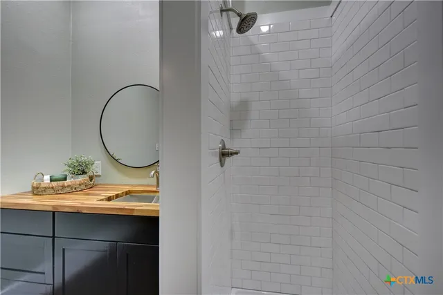 a bathroom with a sink and a mirror