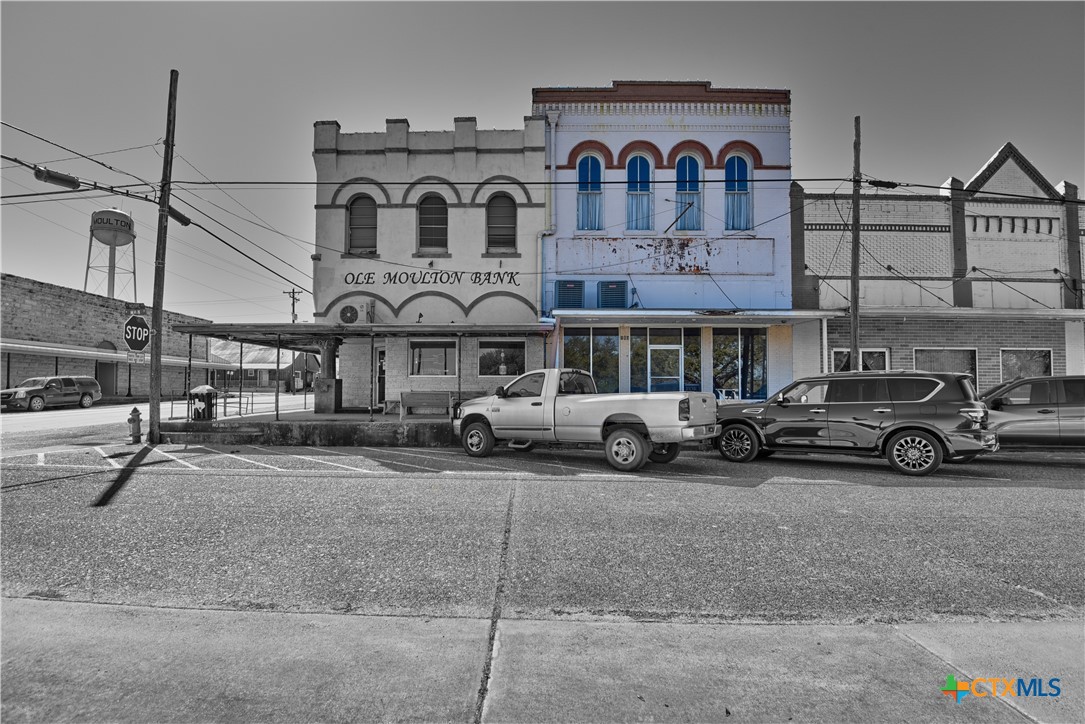 103 North Main Street, Unit B Moulton, TX 77975 - Photo 24 of 28 a view of a street that has couple of cars parked on the road