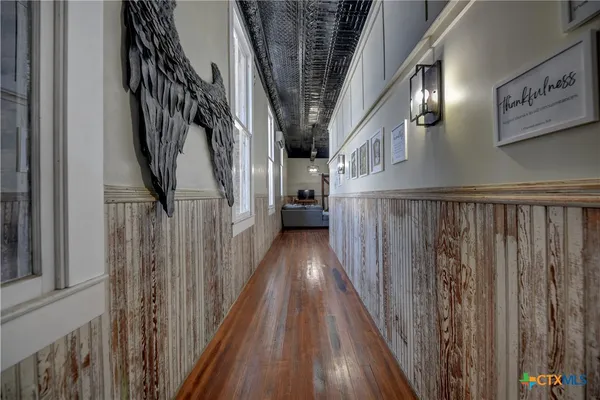 a view of staircase with wooden floor