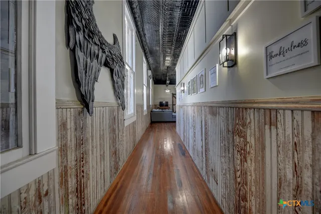 a view of staircase with wooden floor