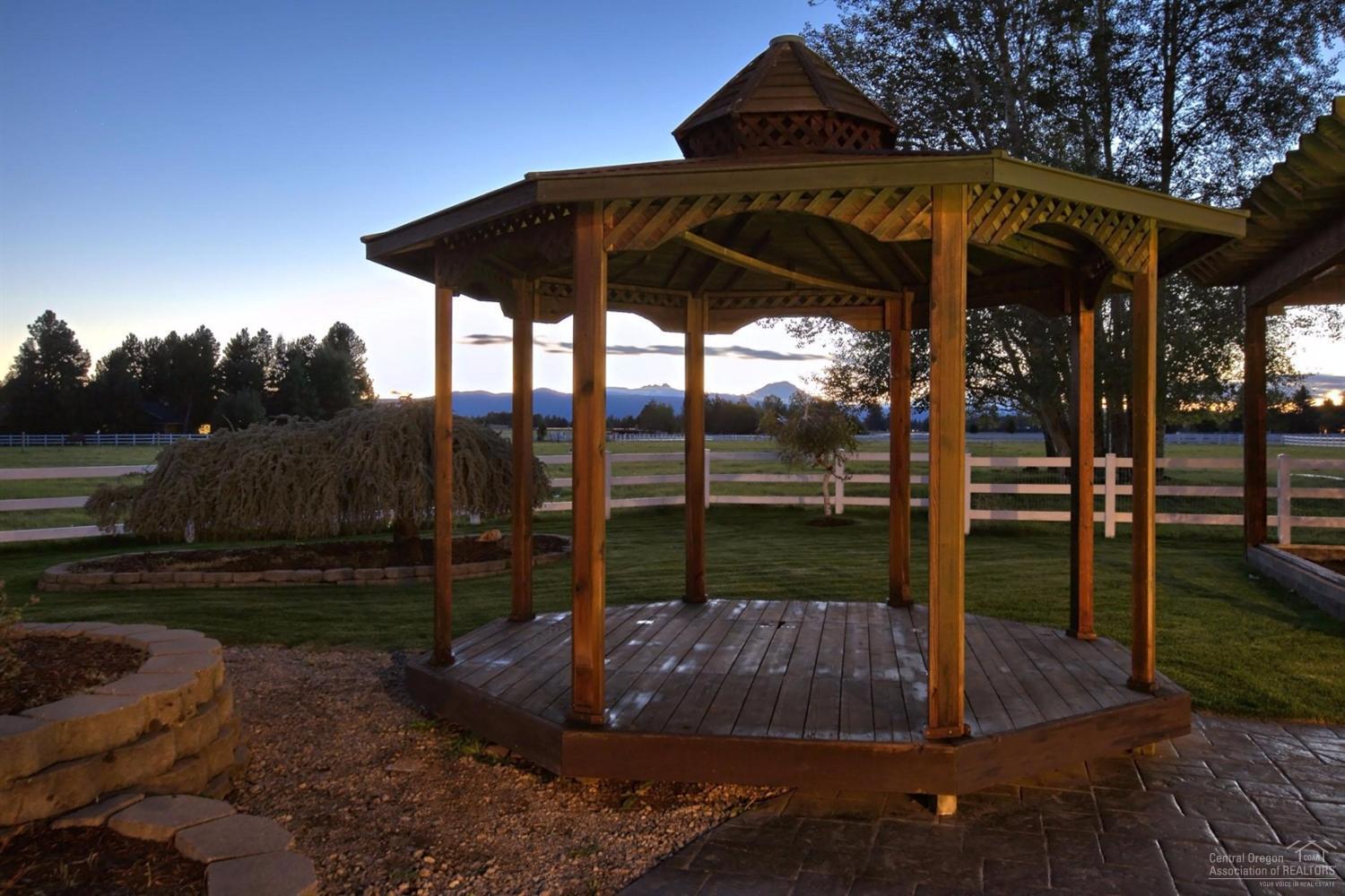 65131 Highland Road Bend, OR 97703 - Photo 22 of 22 a view of a porch with a yard