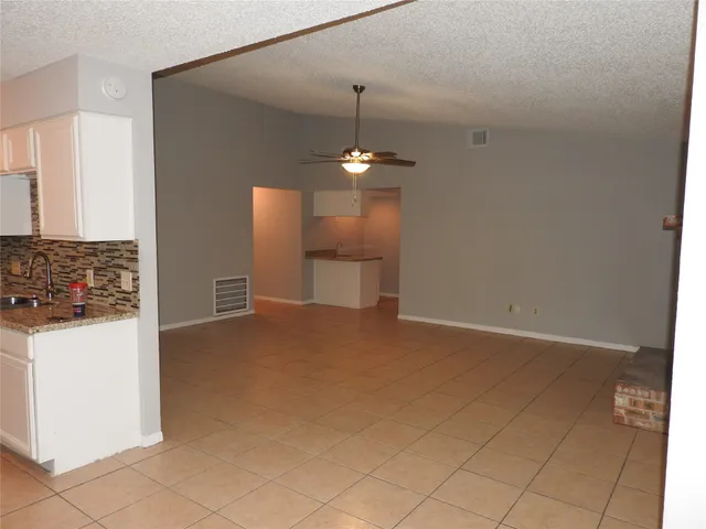 a view of a kitchen with a sink and a stove