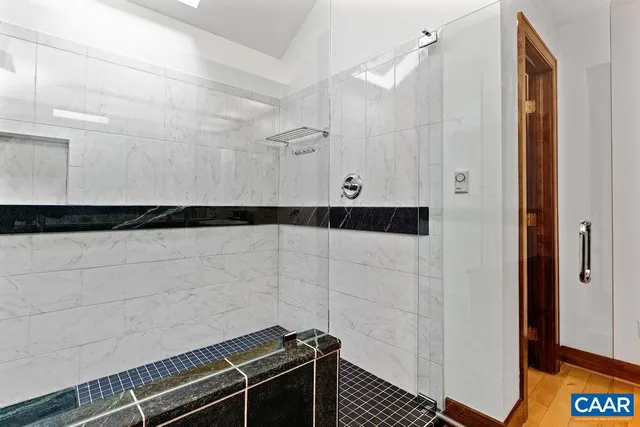 a bathroom with a shower and a sink