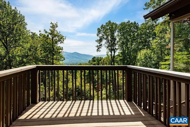 a bathroom with a toilet sink vanity and mirror