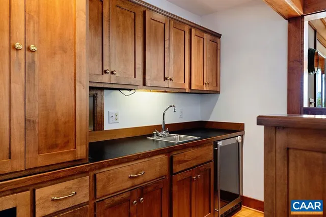 a kitchen with granite countertop cabinets and window