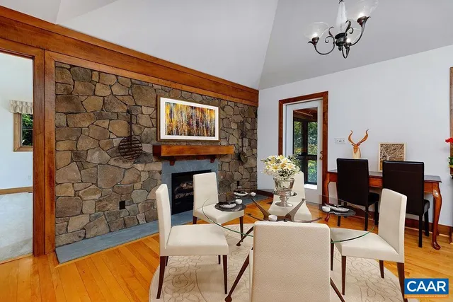 a living room with fireplace furniture and a flat screen tv