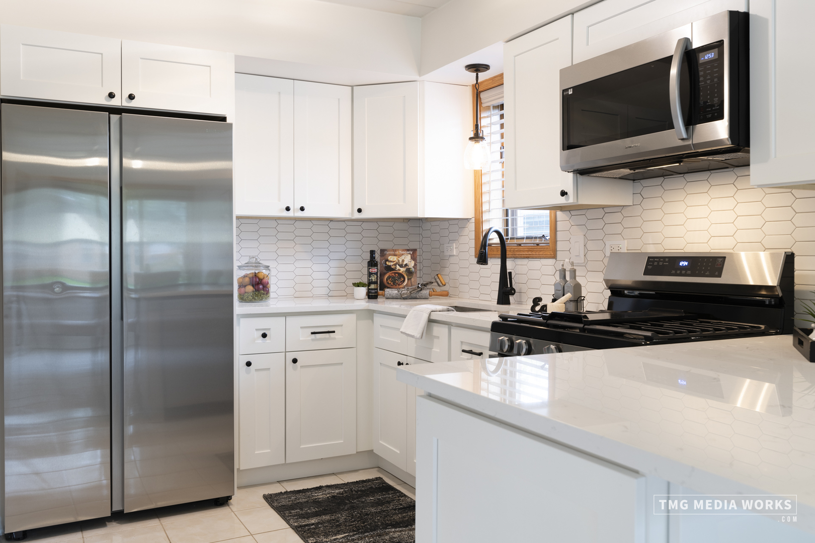 616 East 5th Avenue, Unit 101 Naperville, IL 60563 - Photo 11 of 57 a kitchen with stainless steel appliances white cabinets a sink and a stove