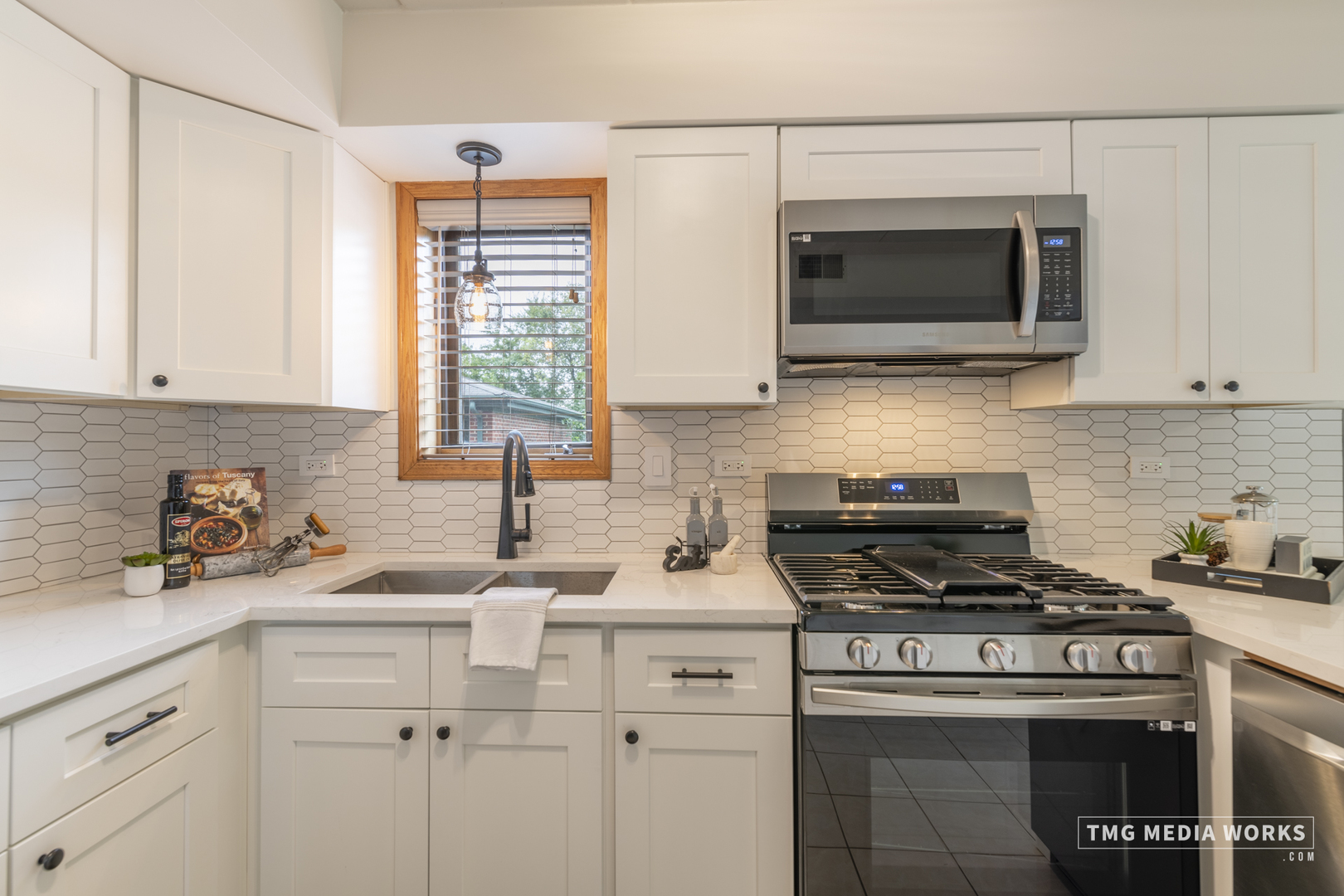 616 East 5th Avenue, Unit 101 Naperville, IL 60563 - Photo 13 of 57 a kitchen with a sink stove and microwave