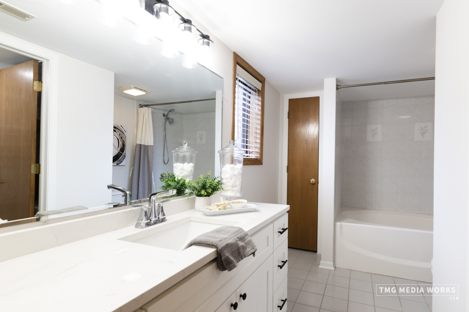 616 East 5th Avenue, Unit 101 Naperville, IL 60563 - Photo 18 of 57 a bathroom with a granite countertop sink and a mirror