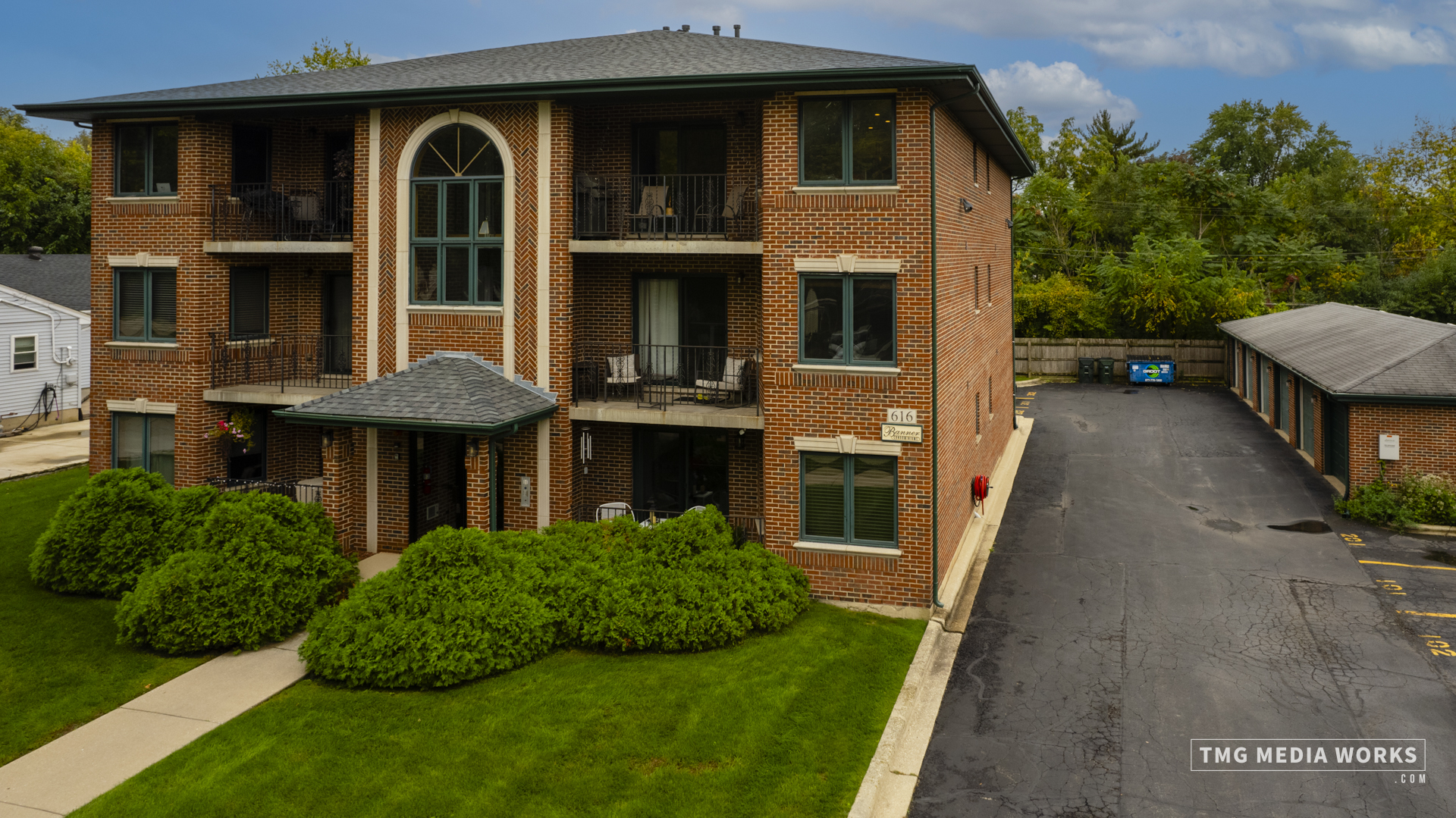 616 East 5th Avenue, Unit 101 Naperville, IL 60563 - Photo 30 of 57 a front view of a house with a yard