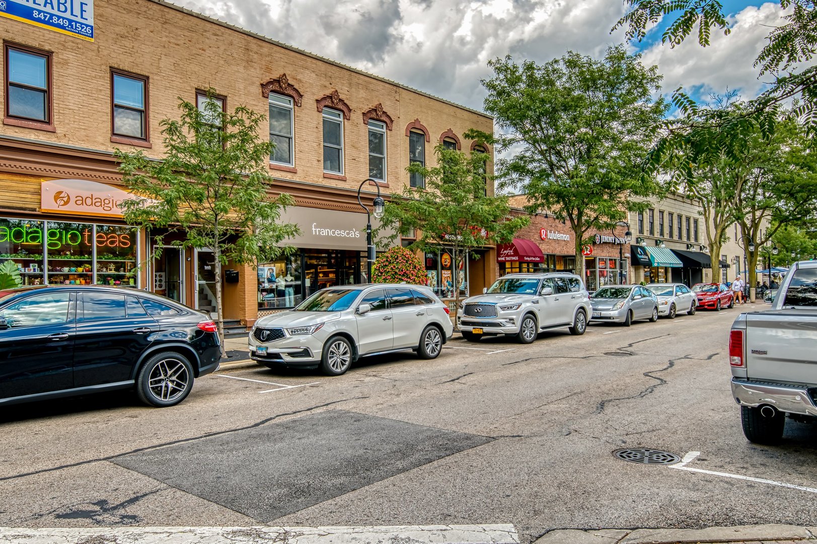 616 East 5th Avenue, Unit 101 Naperville, IL 60563 - Photo 41 of 57 a view of a cars parked in front of a building