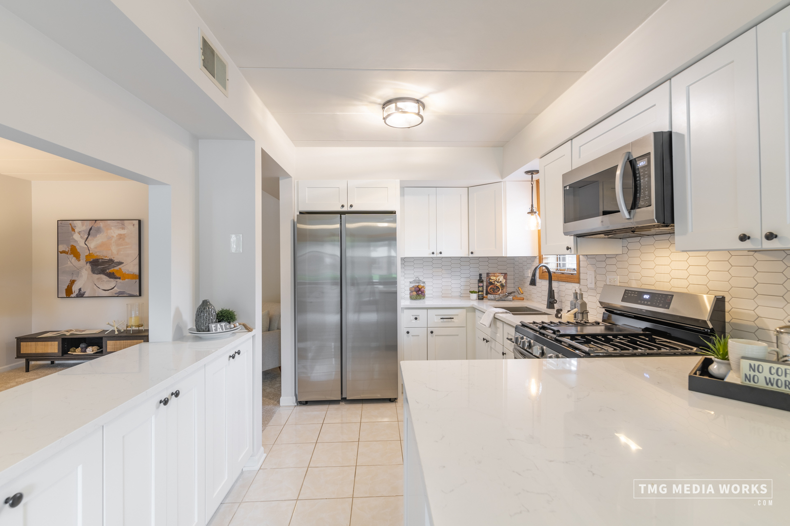 616 East 5th Avenue, Unit 101 Naperville, IL 60563 - Photo 9 of 57 a kitchen with stainless steel appliances a refrigerator stove microwave and sink