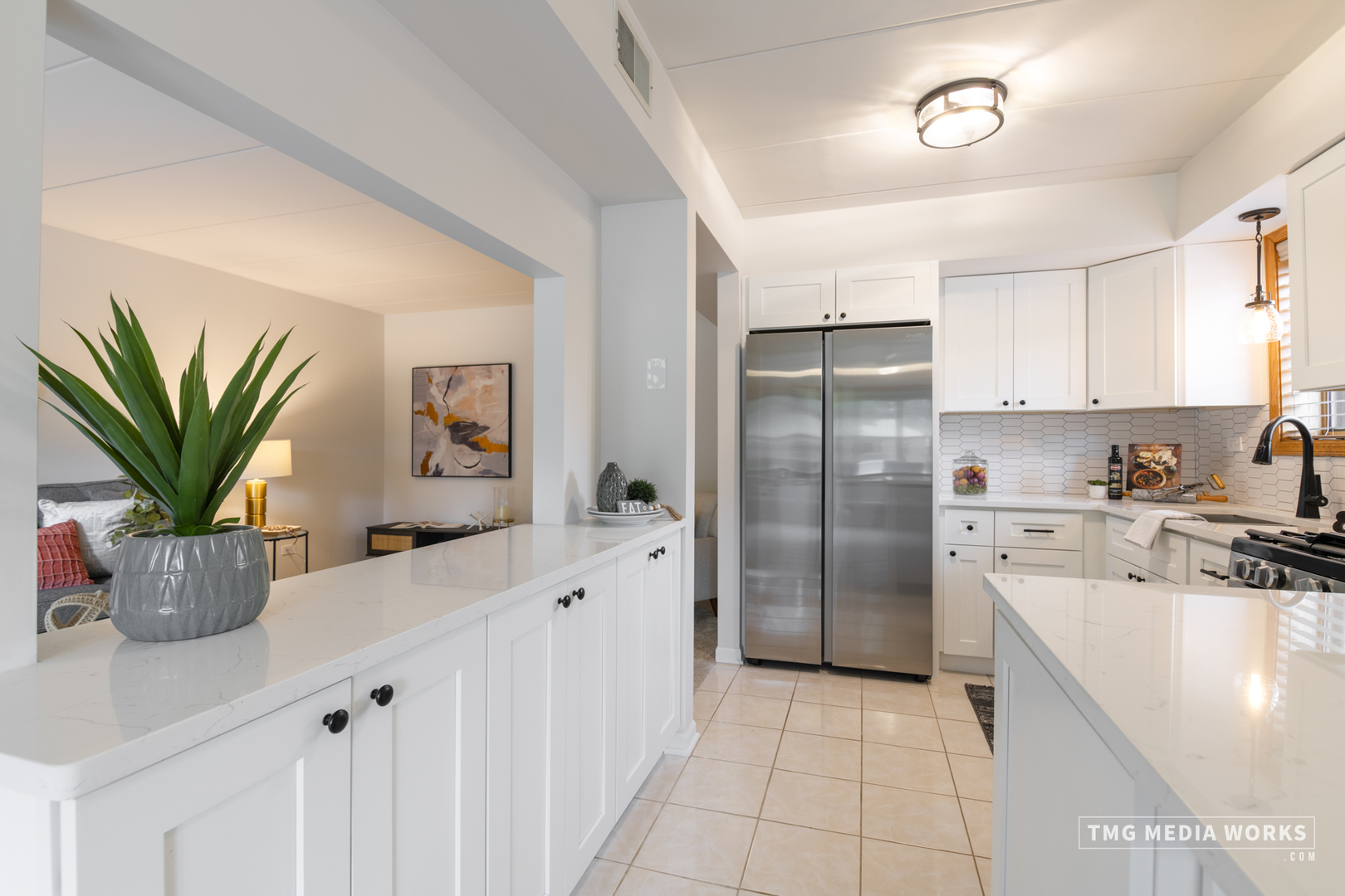 616 East 5th Avenue, Unit 101 Naperville, IL 60563 - Photo 10 of 57 a kitchen with a refrigerator a sink and cabinets