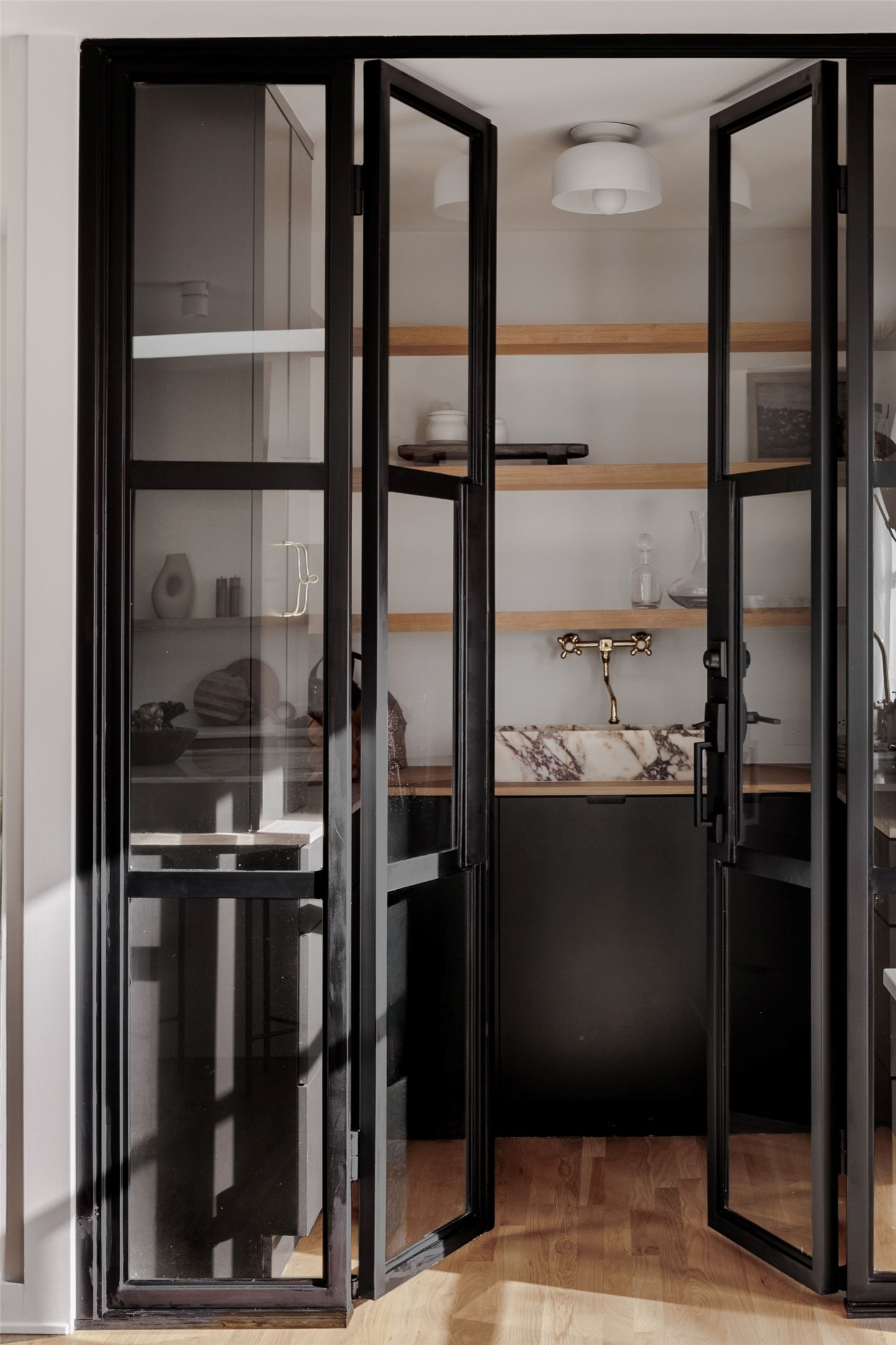 4515 Bull Creek Road Austin, TX 78731 - Photo 11 of 33 A true prep pantry with custom white oak shelving, Calacatta Viola marble sink, and concealed outlets—designed to keep countertop appliances tucked away and the kitchen pristine.