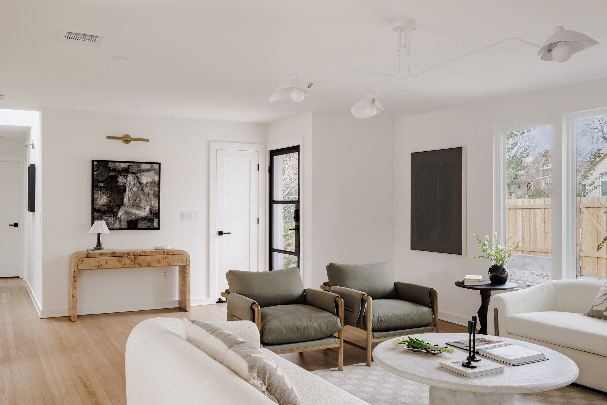 4515 Bull Creek Road Austin, TX 78731 - Photo 13 of 33 Step into an open-concept living space with solid white oak flooring, fresh modern finishes, and updated LED lighting—fully renovated down to the studs for true turnkey living.