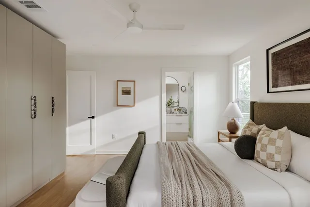 a bedroom with a bed and a couch