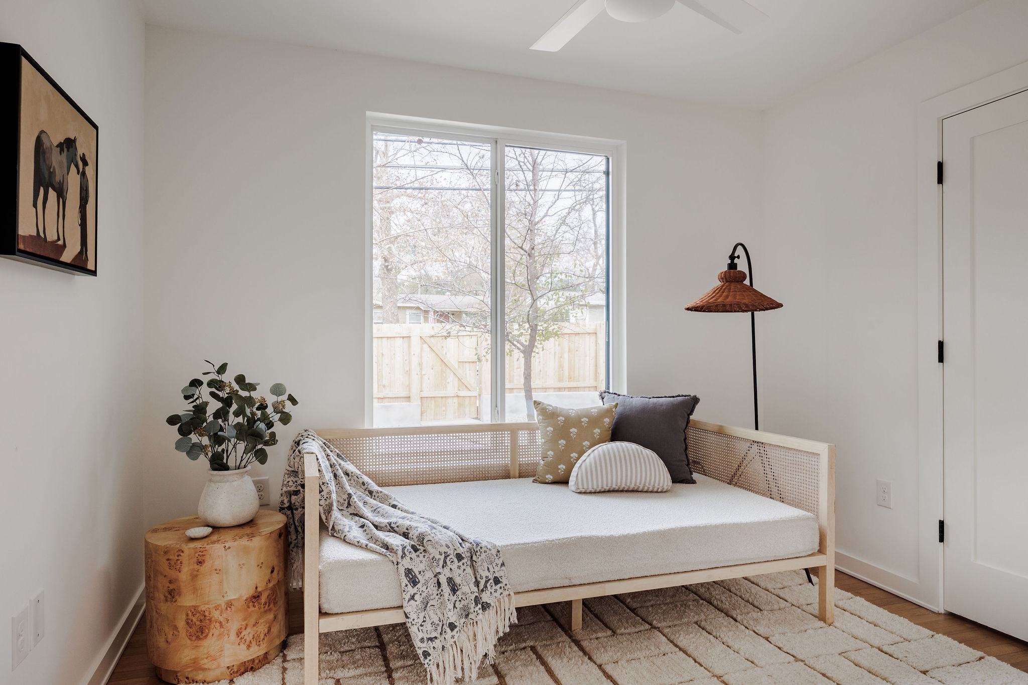 4515 Bull Creek Road Austin, TX 78731 - Photo 18 of 33 A bright secondary bedroom with generous natural light and a versatile layout—ideal for guests, a home office, or a thoughtfully styled kid’s room.