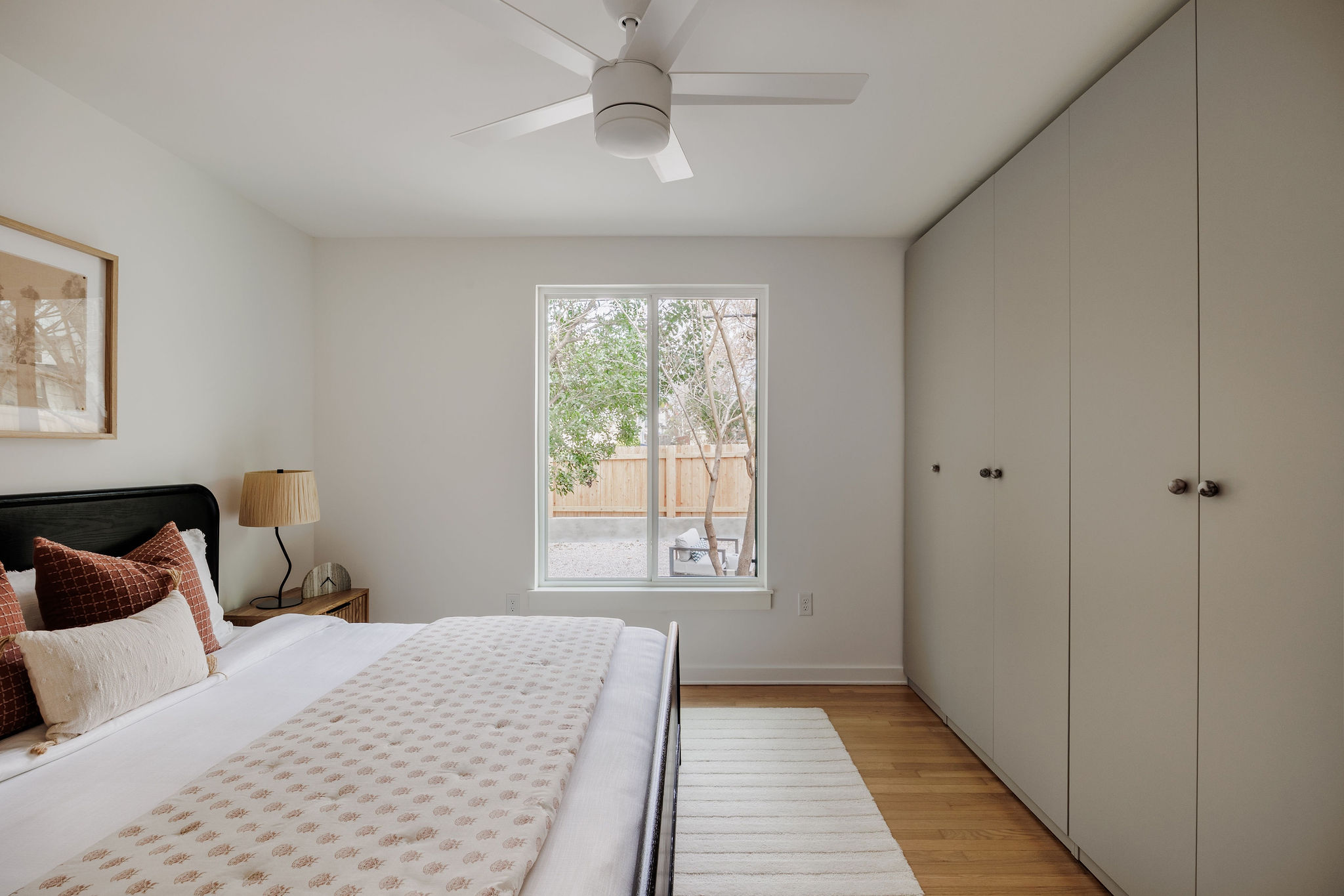 4515 Bull Creek Road Austin, TX 78731 - Photo 25 of 33 Custom built-in wardrobe cabinetry offers sleek, functional storage with a clean modern look