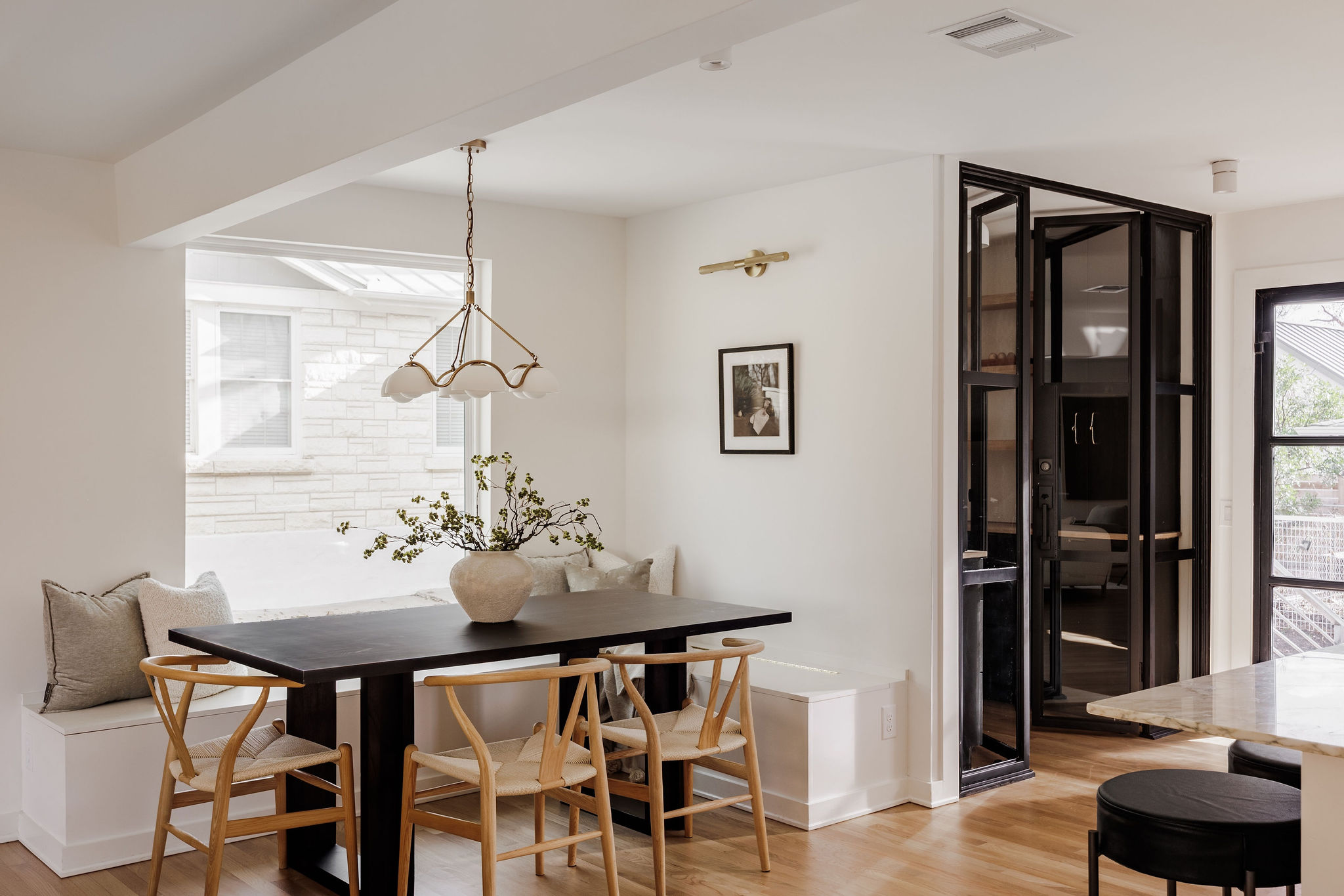 4515 Bull Creek Road Austin, TX 78731 - Photo 10 of 33 An inviting dining space sits just off the kitchen—perfect for hosting—while the custom walk-in pantry offers a rare, elevated bonus you’ll love using daily.