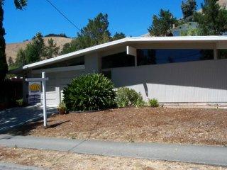 654 Las Colindas Road San Rafael, CA 94903 - Photo 1 of 1 a front view of a house with a yard
