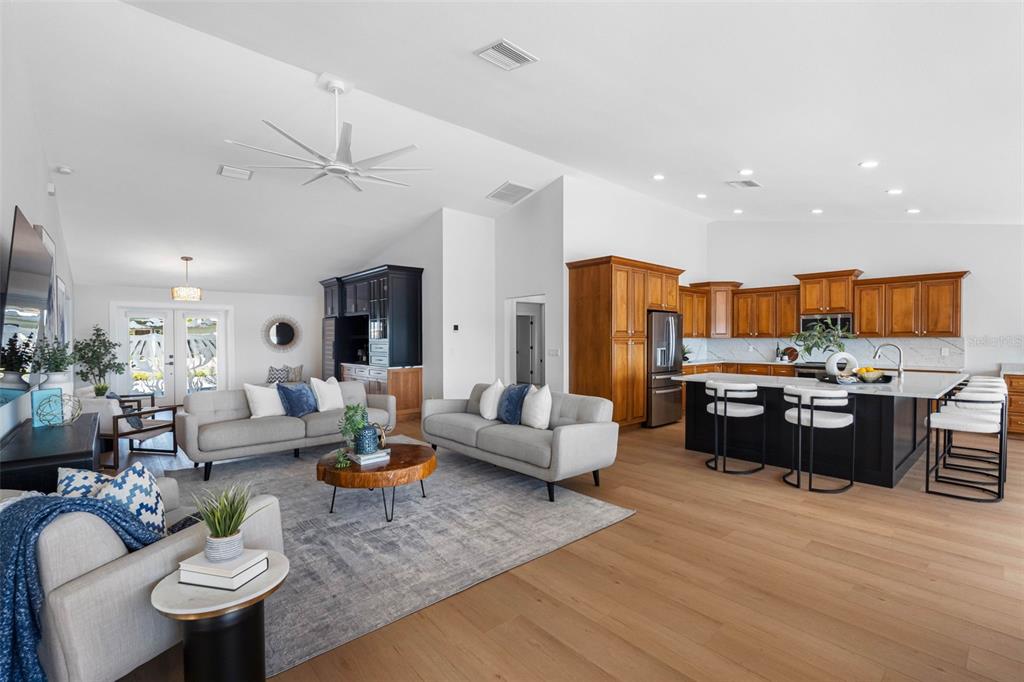 517 Johns Pass Avenue Madeira Beach, FL 33708 - Photo 18 of 92 a living room with furniture kitchen view and a large window