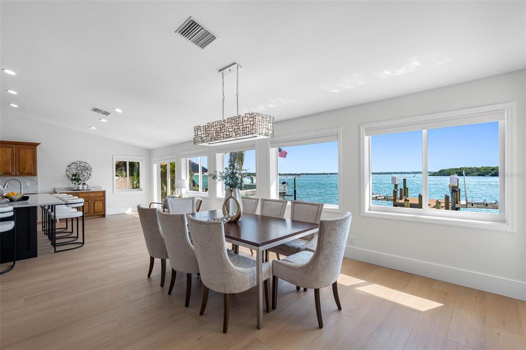 517 Johns Pass Avenue Madeira Beach, FL 33708 - Photo 20 of 92 a view of a dining room with furniture window and wooden floor