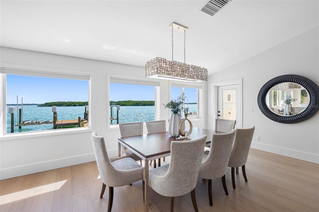 517 Johns Pass Avenue Madeira Beach, FL 33708 - Photo 23 of 92 a view of a dining room with furniture window and outside view