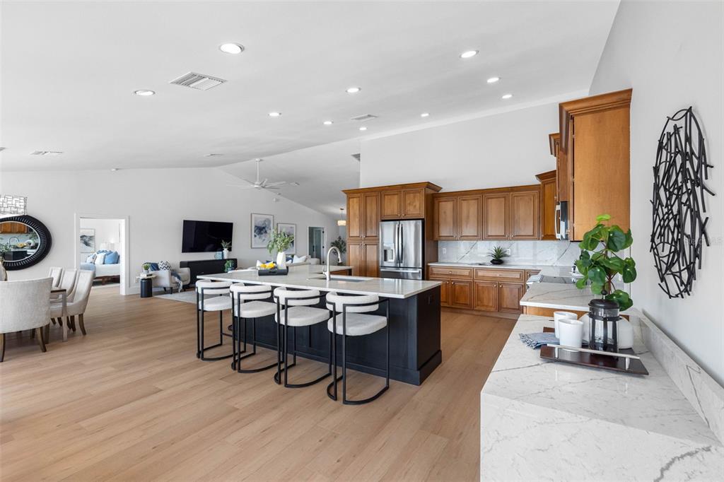 517 Johns Pass Avenue Madeira Beach, FL 33708 - Photo 26 of 92 a living room with lots of furniture and a flat screen tv