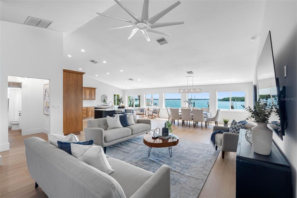 517 Johns Pass Avenue Madeira Beach, FL 33708 - Photo 4 of 92 a living room with furniture fireplace and a large window