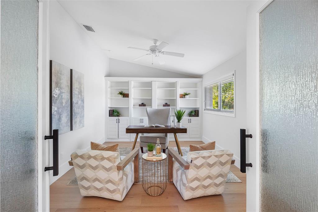 517 Johns Pass Avenue Madeira Beach, FL 33708 - Photo 5 of 92 a living room with furniture and wooden floor