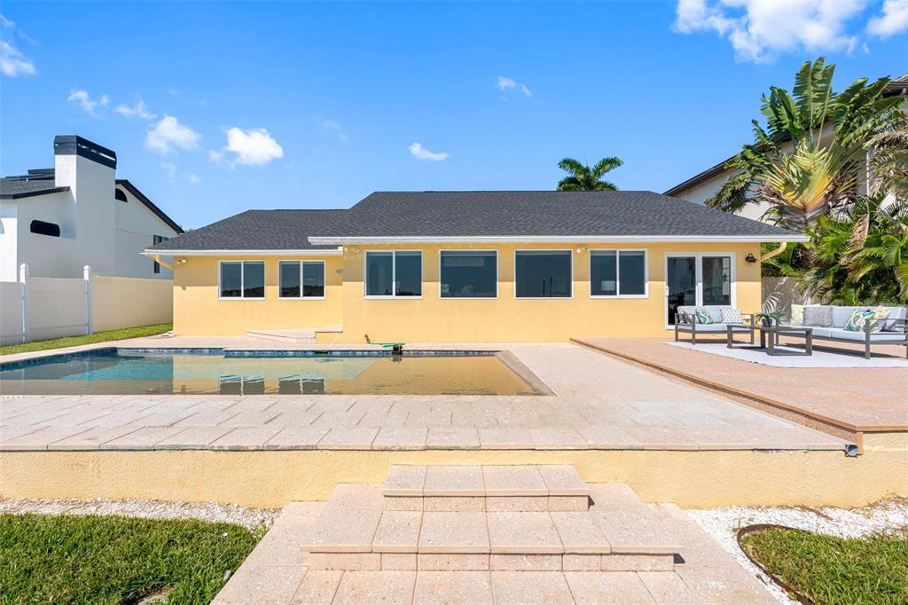 517 Johns Pass Avenue Madeira Beach, FL 33708 - Photo 53 of 92 a front view of a house with a yard