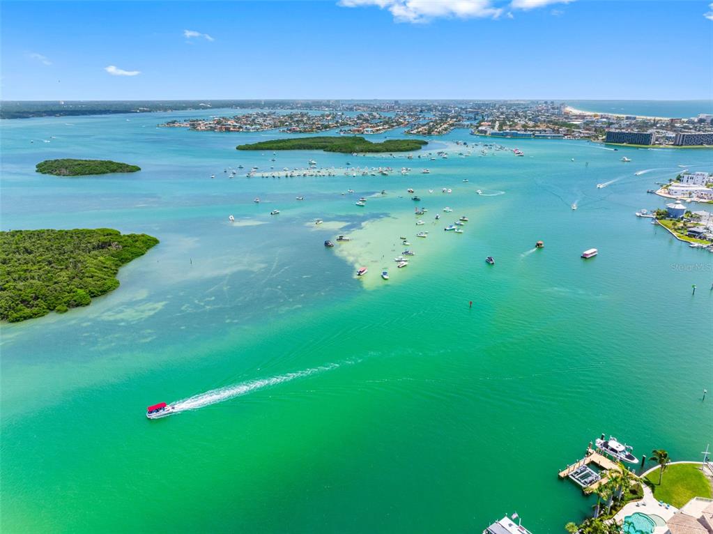517 Johns Pass Avenue Madeira Beach, FL 33708 - Photo 90 of 92 a view of a golf course with an outdoor space and seating