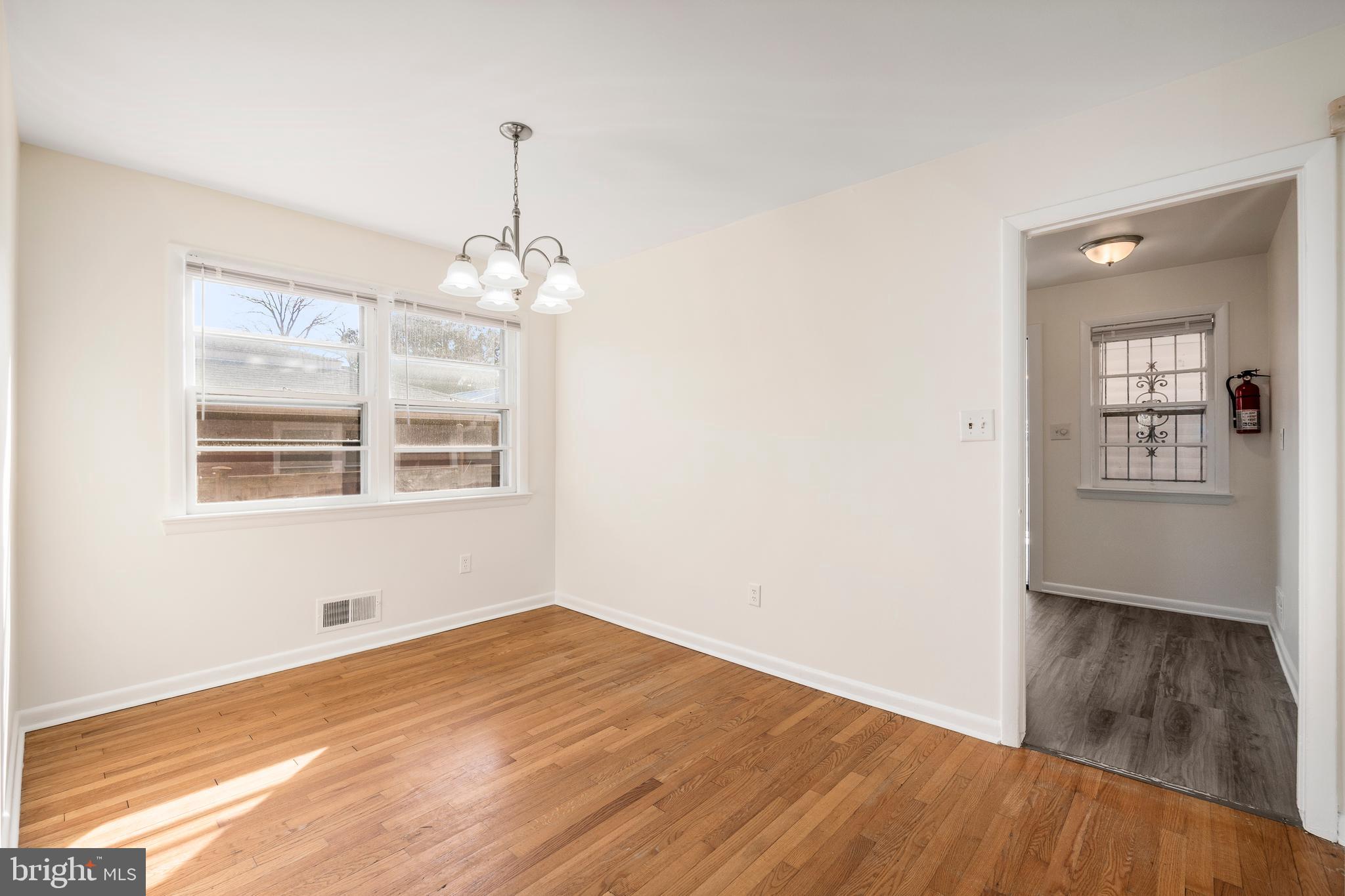 4208 16th Street Northwest Washington, DC 20011 - Photo 12 of 47 a view of empty room with wooden floor and fan