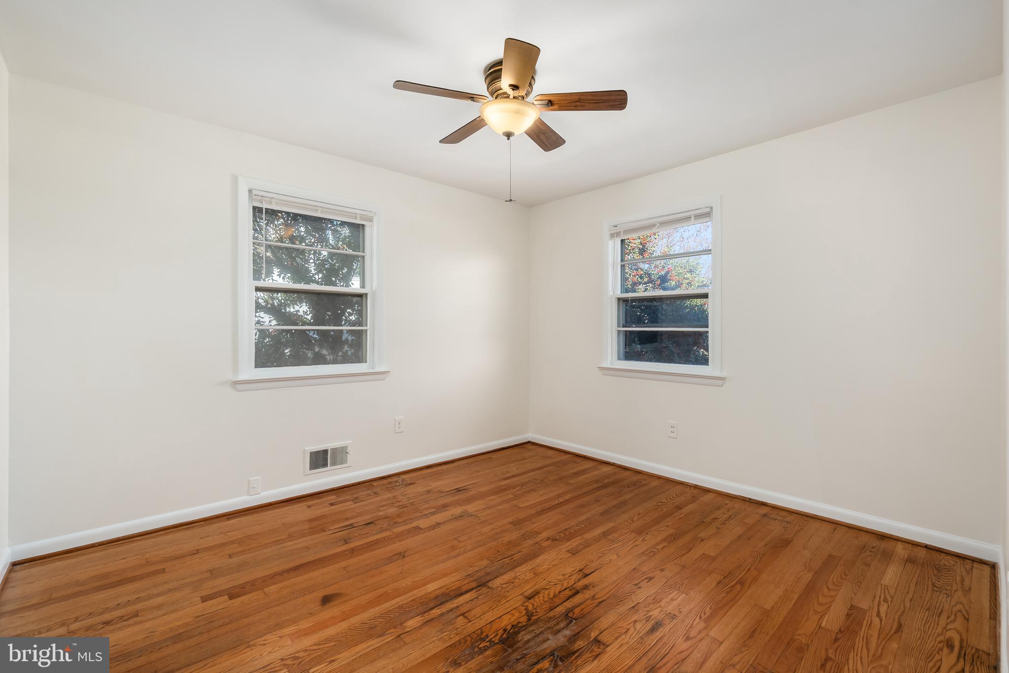4208 16th Street Northwest Washington, DC 20011 - Photo 29 of 47 a view of empty room with wooden floor and fan